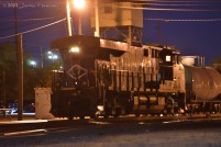 The Lehigh Valley heritage unit, NS 8104, basks in the light of the yard tower as night falls in Danville